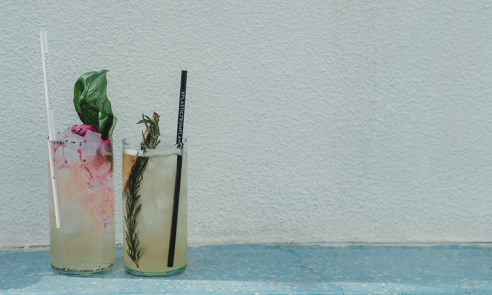 Two glasses of cocktails with Plantastic's biodegradable drinking straws